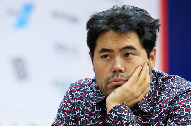 Chess grandmaster Hikaru Nakamura concentrating during a professional tournament match at a chess board