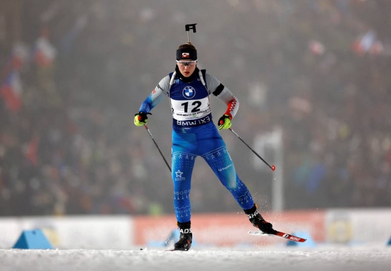 Two biathlon athletes from Greenland training with skis and rifles for Winter Olympics