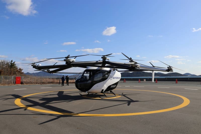 Compact electric flying car with multiple rotors at test facility in Yamaguchi, Japan