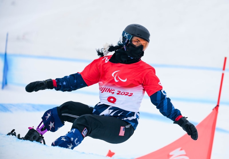 Paralympic snowboarder Brenna Huckaby wearing Team USA gear during photo shoot