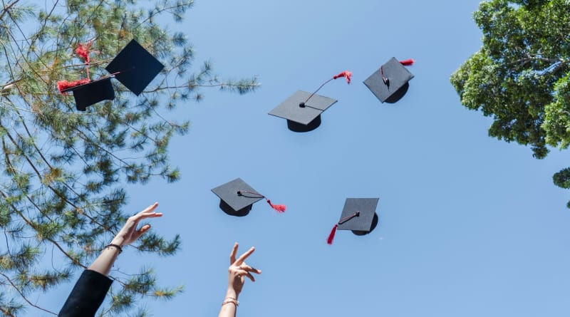Wisconsin dairy farm with cattle grazing in green pastures under blue sky