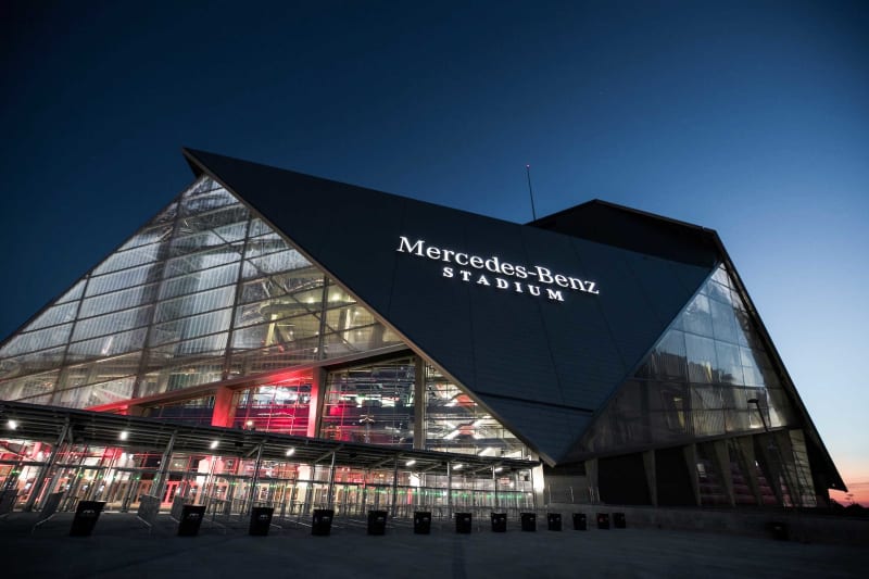 Mercedes-Benz Stadium's impressive modern exterior with distinctive retractable roof in downtown Atlanta at sunset