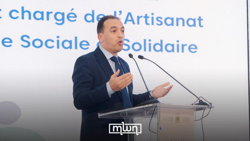 Moroccan cooperative members working together in traditional handicraft workshop celebrating job creation