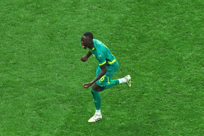 Pape Gueye celebrating in Senegal national team jersey after scoring winning AFCON goal