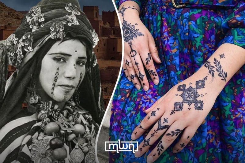 Amazigh woman in traditional dress displaying intricate henna patterns on her hands