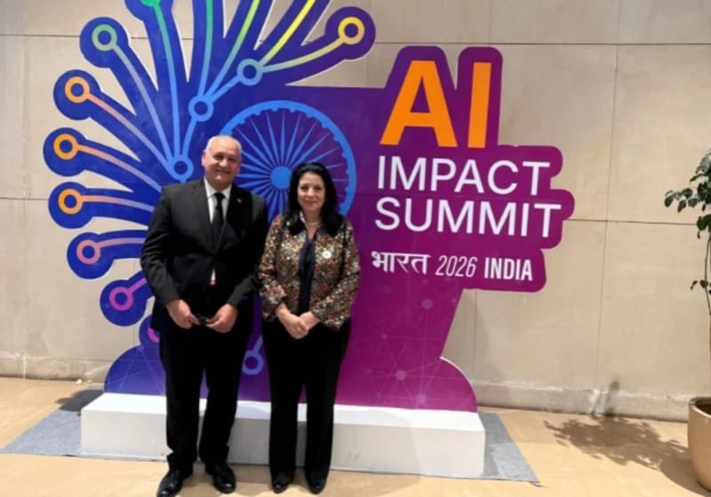 Moroccan and Indian officials shaking hands at AI Impact Summit in New Delhi