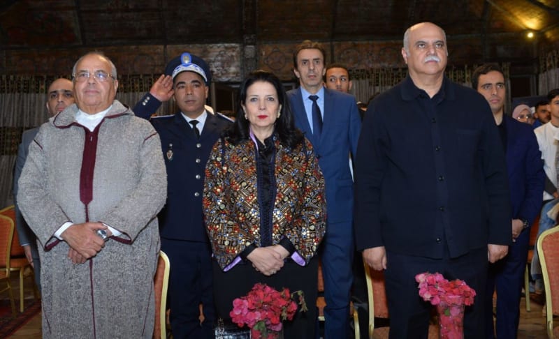 Young Moroccan innovators collaborate on laptops during AI hackathon in desert region