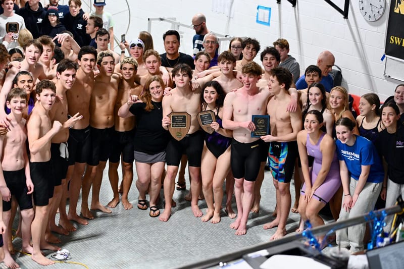 Martha's Vineyard Regional High School swim team celebrating at Cape and Islands League Championships