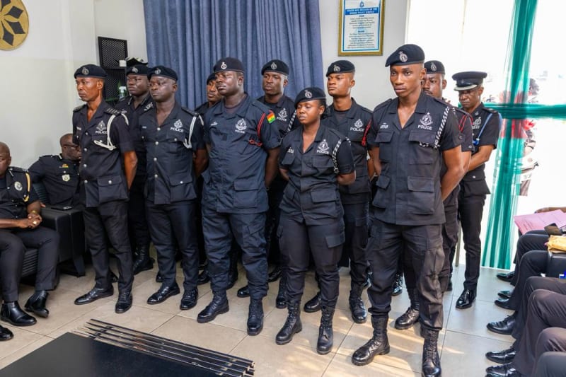 Ghana Police Inspector-General Christian Tetteh Yohuno congratulating promoted police officers in formal ceremony