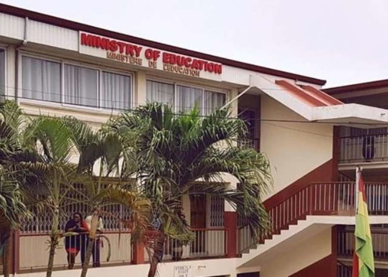 Diverse Ghanaian students learning with technology in a bright, modern classroom setting