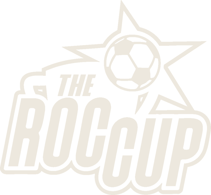 Young African soccer players competing on field during youth tournament in Ghana stadium