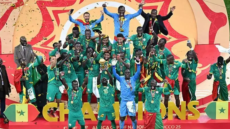 Senegal national football team celebrating together after AFCON tournament victory on field