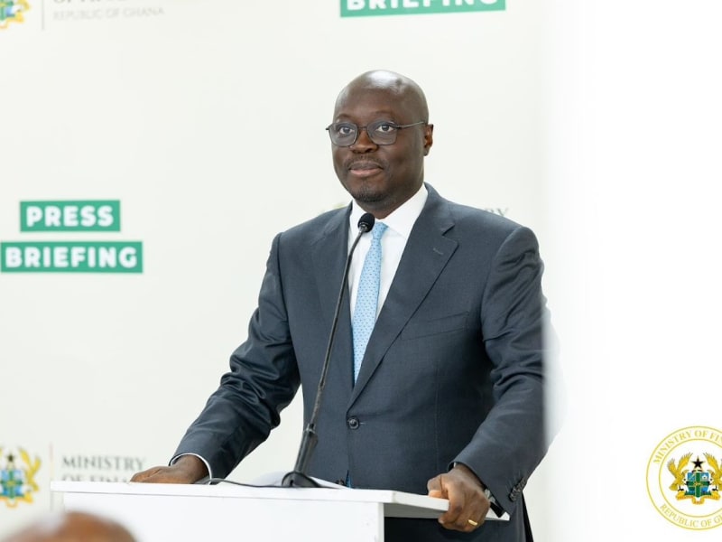 Workers processing cocoa beans at a Ghanaian chocolate manufacturing facility showing value-added production