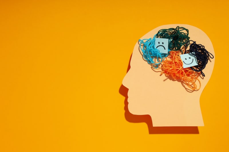 Medical professional holding GLP-1 medication vial representing hope for mental health patients' longevity