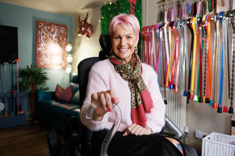 Colorful custom walking sticks in silver, aquamarine and emerald displayed by Neo Walk company