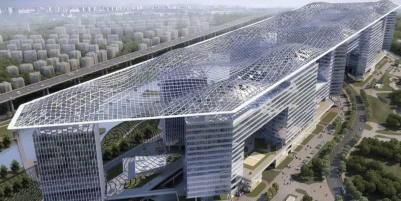 Semi-transparent solar panels installed on modern building allowing filtered sunlight through while generating renewable energy