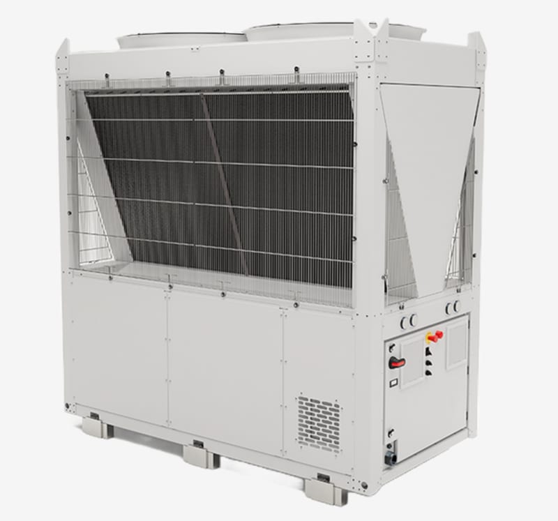 Modern industrial heat pump units installed outside a commercial building with connecting pipes