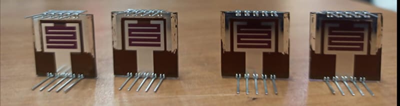 Diagram showing layered structure of transparent perovskite-silicon tandem solar cell with multiple material components