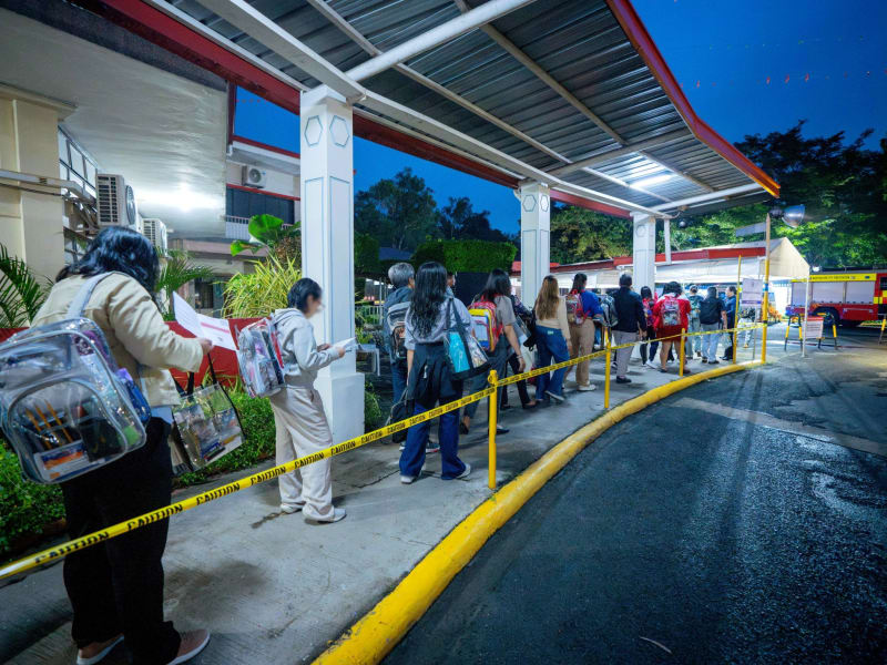 New lawyers celebrating their Bar Exam success with joy and raised hands in the Philippines courtroom