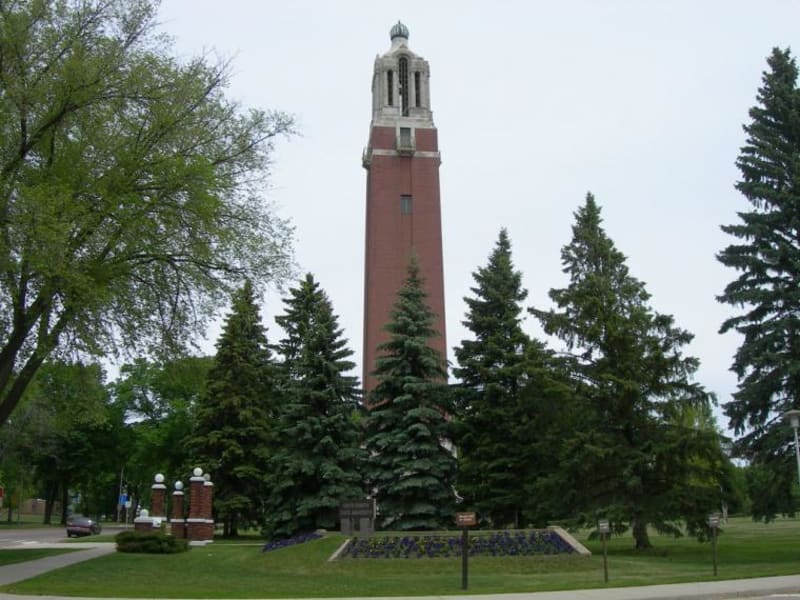 South Dakota State University campus with students walking between academic buildings on sunny day