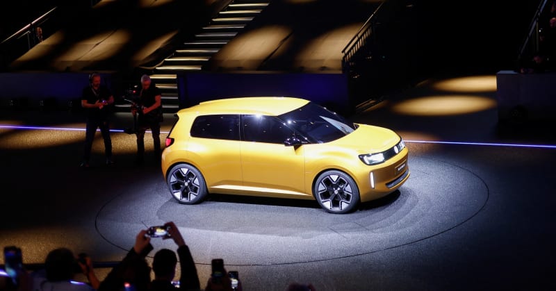 Modern electric vehicles displayed at European auto showroom representing historic sales milestone