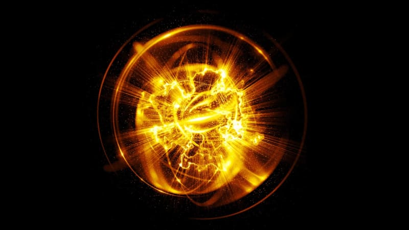 Close-up of manganese metal pieces on laboratory surface with chemical reaction equipment