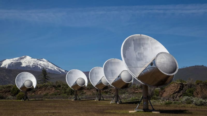 Allen Telescope Array radio dishes pointed skyward at Hat Creek Radio Observatory in California at sunset