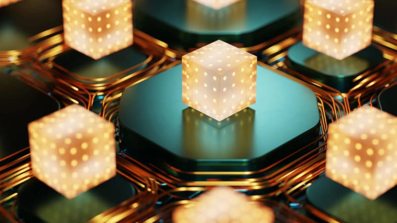 Glowing interconnected quantum computing qubits arranged in geometric pattern on circuit board