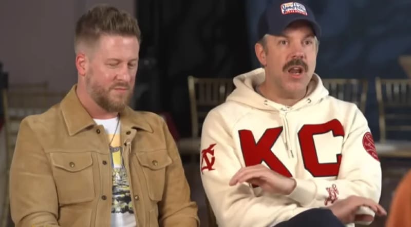 Jason Sudeikis and Billy Brimblecom smiling together at charity event