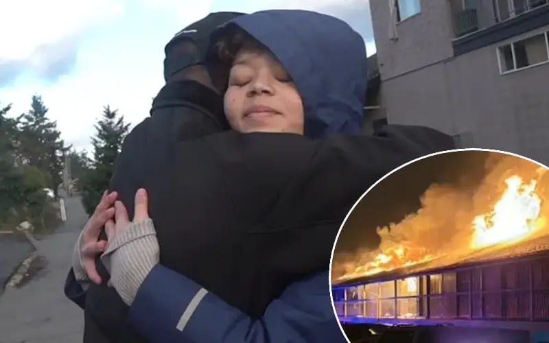 Mother Elizabeth Manson stands outside motel building where she heroically saved dozens of lives from fire