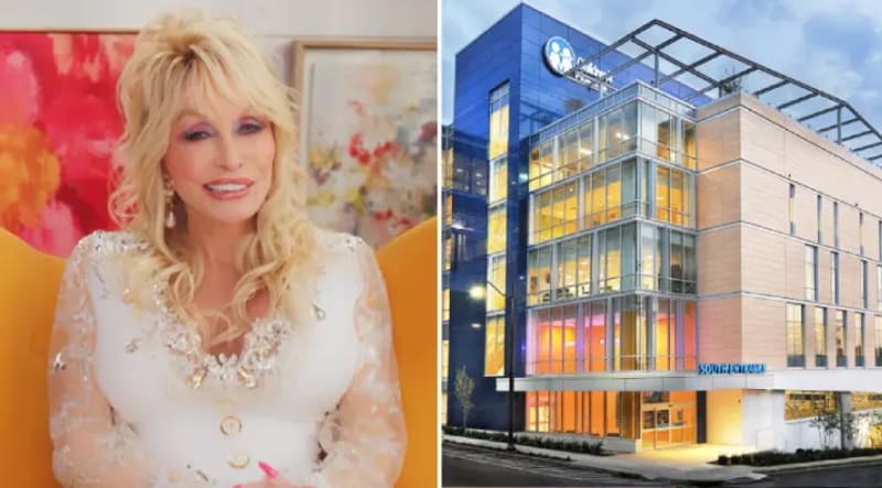 Dolly Parton smiling in front of East Tennessee Children's Hospital building