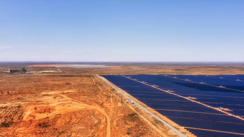 Solar panels installed on residential rooftops in Australia under bright sunny sky