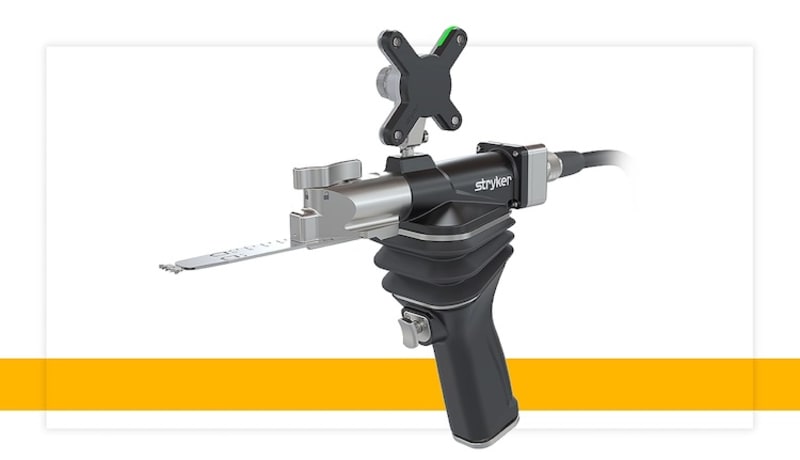 Surgeon holding Stryker's new Mako RPS handheld robotic surgical system for knee replacement procedures