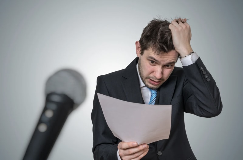 Two professionals having an engaged, confident conversation in a modern office setting