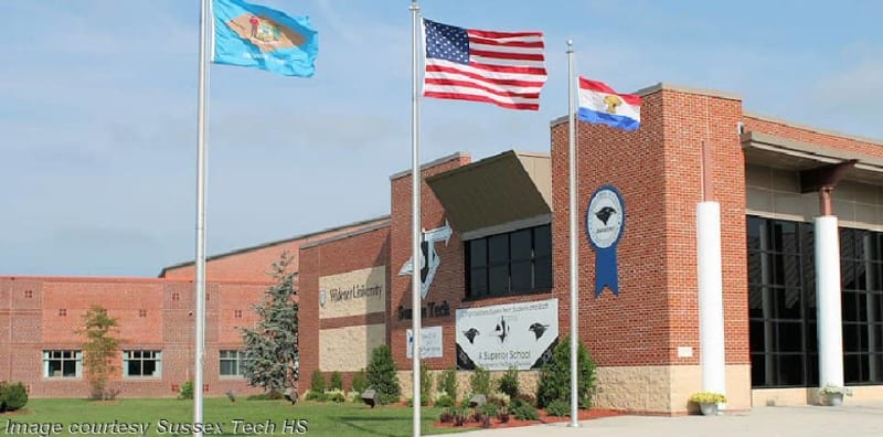 High school students using computers to analyze environmental mapping data in plant science classroom
