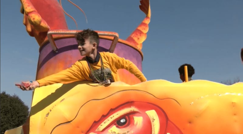 Students and teachers from Mobile's Eichold-Mertz school celebrating academic achievement with outdoor parade
