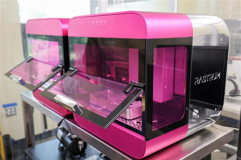 Robotic bioprinting arm creating tissue structures in biotechnology laboratory at community college