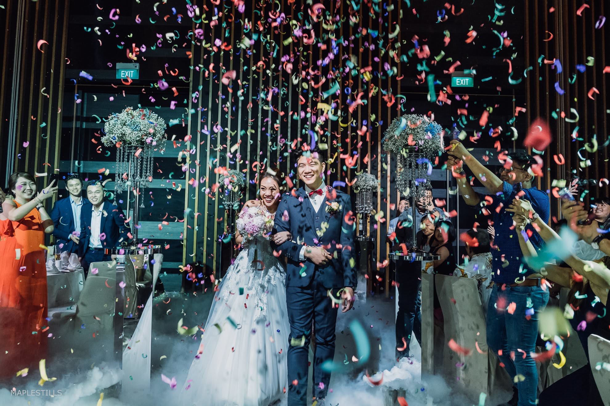 Wedding photography at Parkroyal Hotel Confetti raining down at spontaneous wedding