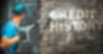 Transunion credit washing. Man power washing the word "Credit History" off of a brick wall.
