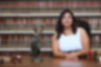 Bankruptcy lawyer posing in front of legal books