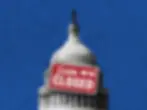 Capital Bbuilding with a sign hung over it saying "Sorry we're closed"