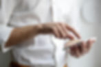 Man using phone to make priority list