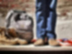 Military employee with military bag and boots