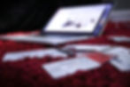 Gift cards and credit cards sprawled around aa open laptop