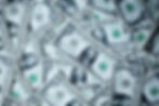 a bunch of one dollar bills laying out