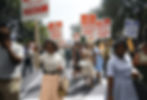 Group of black people protesting carrying signs
