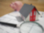 Saving for a home. Piggy Bank and house on map