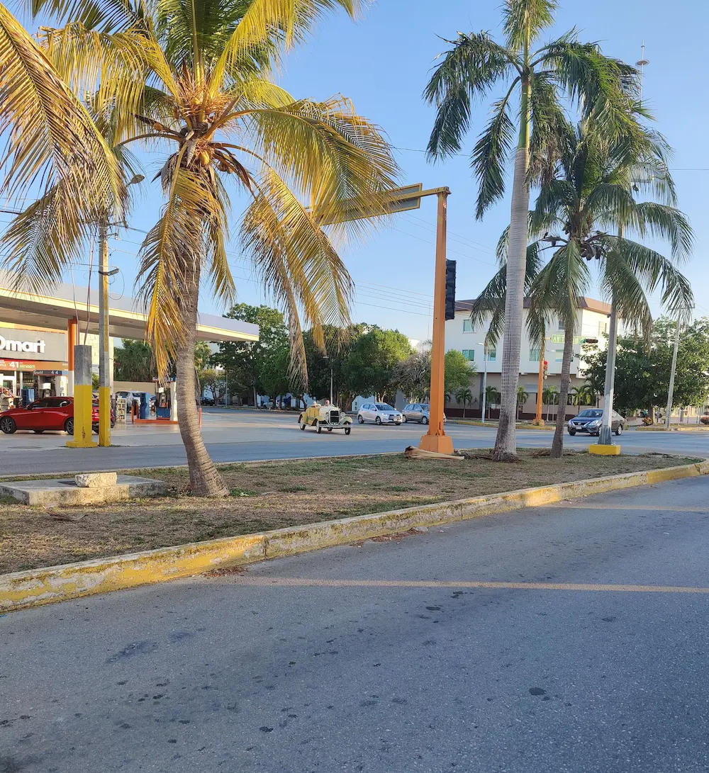 Evening Cancun street with city lights and transportation