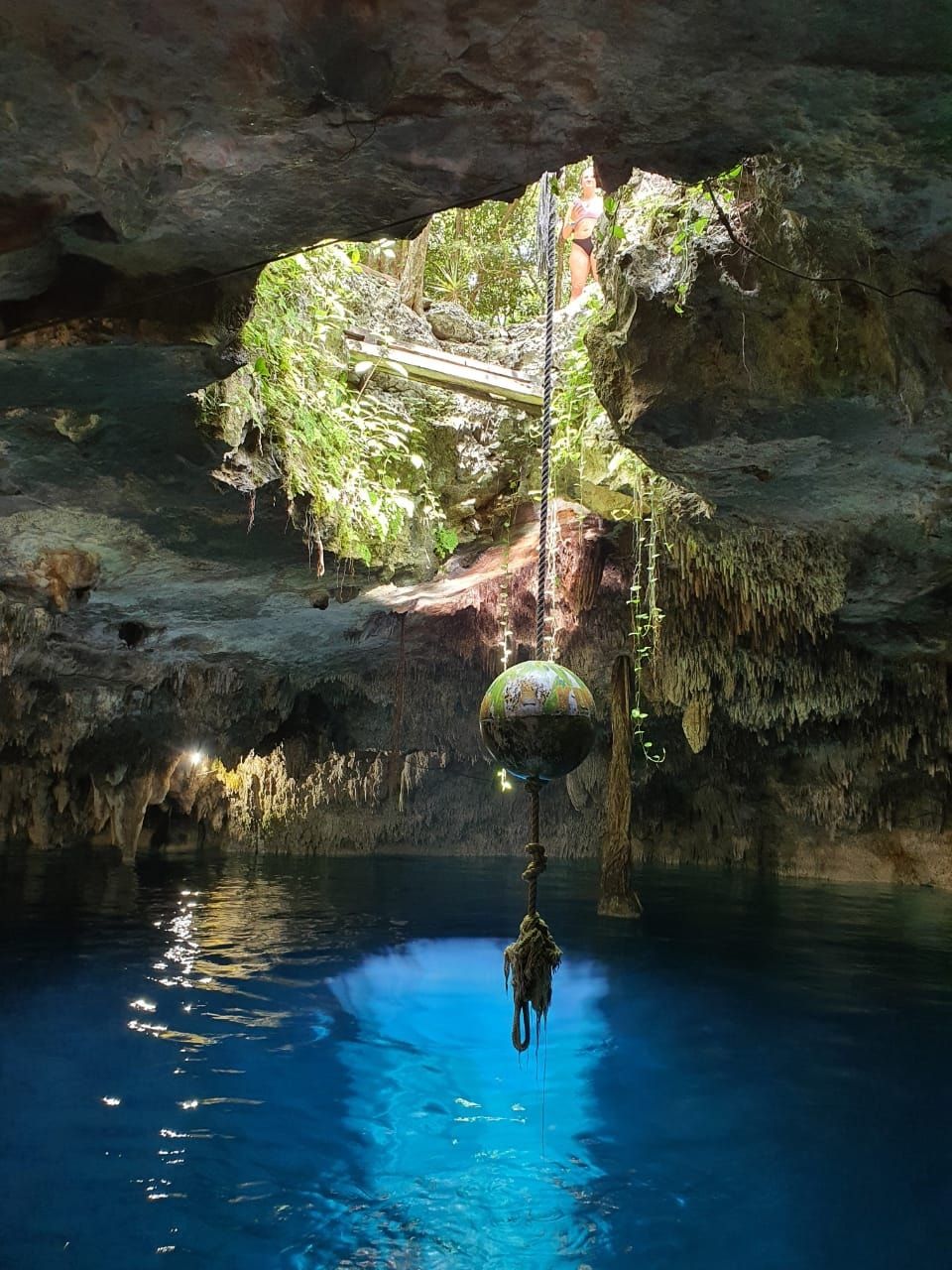 Underground cave river and rock formations at Cenote Kin Ha