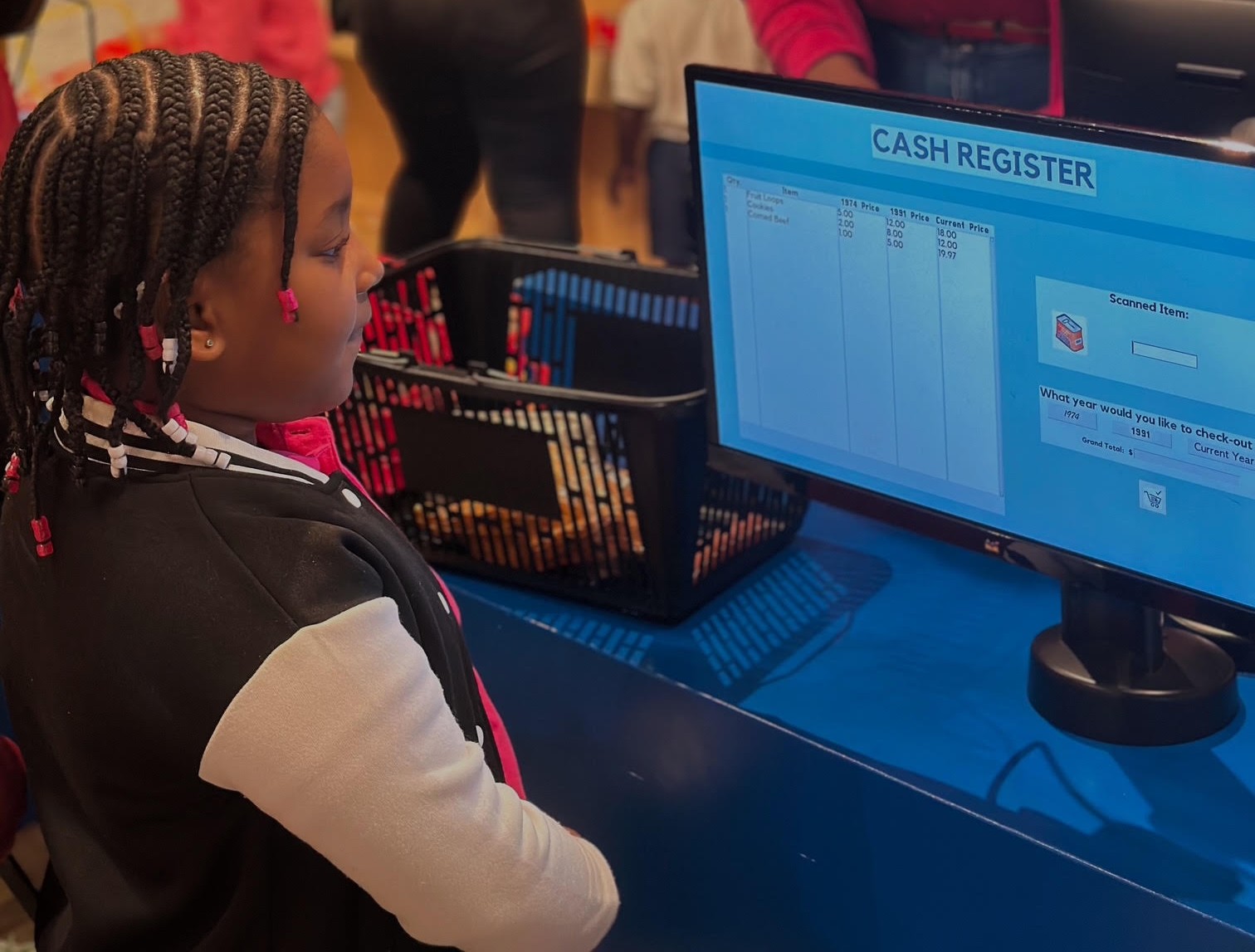 Arianna Moses at the Cashier at the museum.